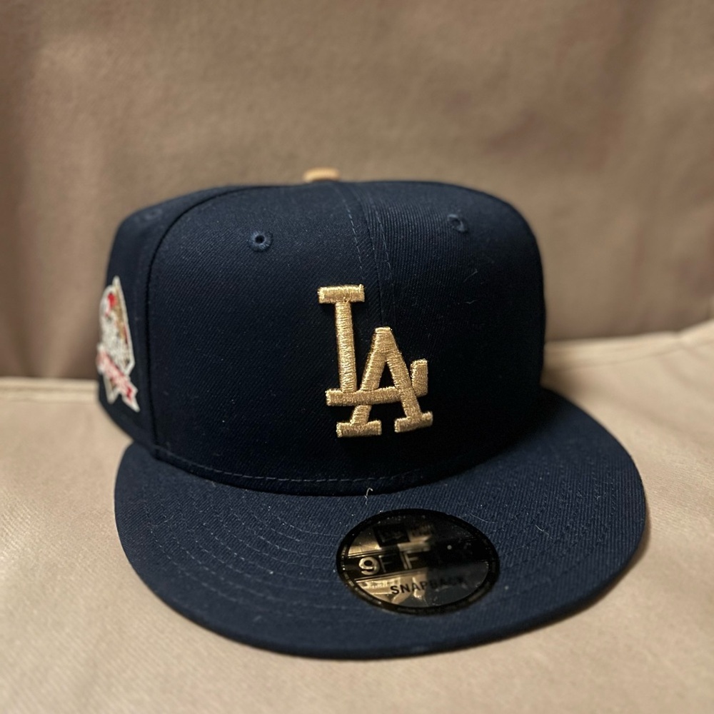 NWT. New Era Blue and Gold Los Angeles Dodgers 2024 Championship Snapback Hat
